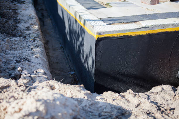 Professional Waterproofing technician working in Woodstock, MD